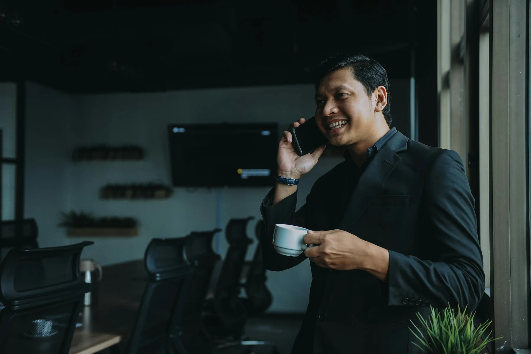 Professional speaking on the phone in an office
