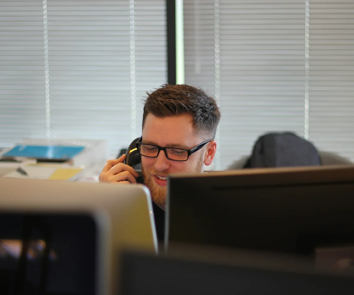 Professional reviewing a phone intake at an office
